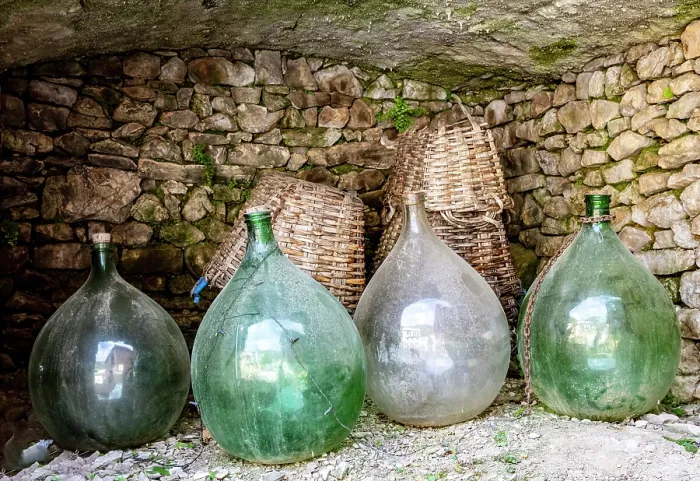 Framed Print : Wine bottles and wicker baskets, the village of Manarola, Cinque Terre, La Spezia district, Liguria, Italy Framed Print : Wine bottles and wicker baskets, the village of Manarola, Cinque Terre, La Spezia district, Liguria, Italy