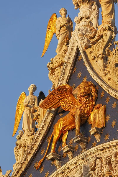 The winged lion of Saint Mark and Angels on Basilica di San Marco, Venice, Veneto, Italy