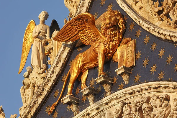 The winged lion of Saint Mark and Angels on Basilica di San Marco, Venice, Veneto, Italy