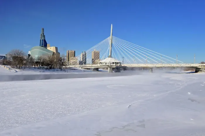 Framed Print : Winnipeg skyline with the Canadian Museum for Human Rights (CMHR) and the Esplanade Riel Bridge and the Red River in winter, Winnipeg, Manitoba, Canada Framed Print : Winnipeg skyline with the Canadian Museum for Human Rights (CMHR) and the Esplanade Riel Bridge and the Red River in winter, Winnipeg, Manitoba, Canada