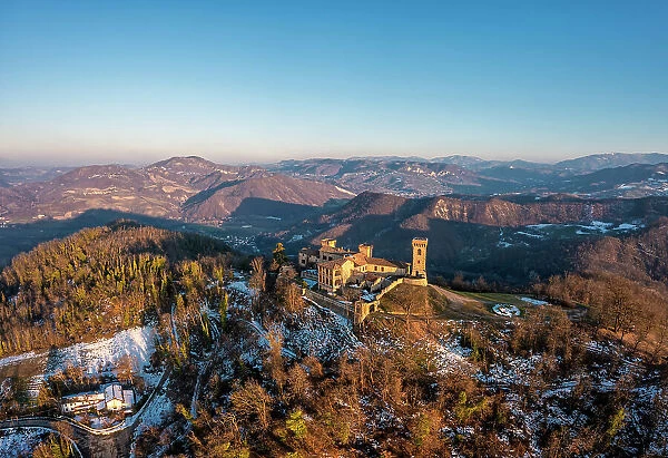 Winter aerial view of the castle San Lorenzo in the Alessandria hills at sunset. Pozzol Groppo, Alessandria province, Piedmont, Italy