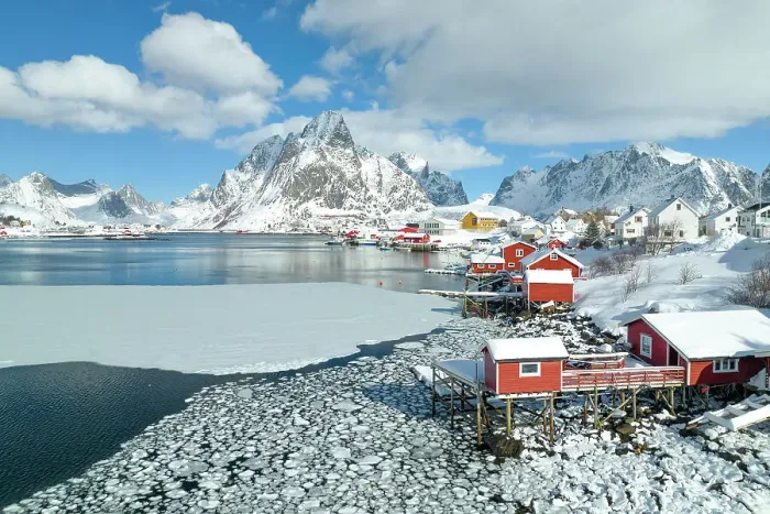 Framed Print : Winter day in Reine village with mountain peak covered with snow, Lofoten Islands, Norway Framed Print : Winter day in Reine village with mountain peak covered with snow, Lofoten Islands, Norway