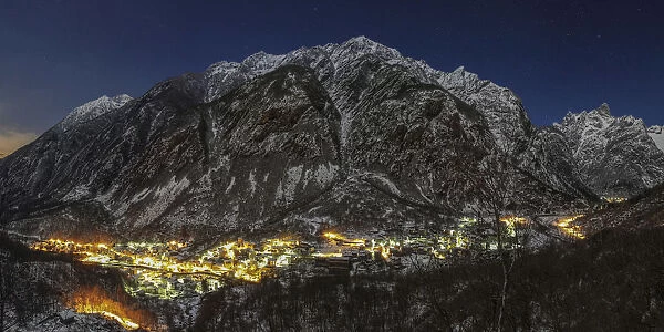 Winter, Masino valley, Filorera and Cataeggio village snowy by night on the moonlight