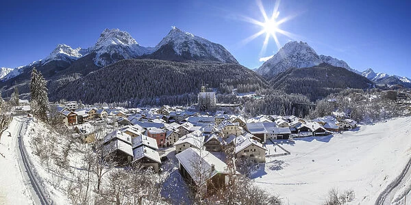 Winter at Scoul village at Engadine, in the background the Lichana peak, Switzerland