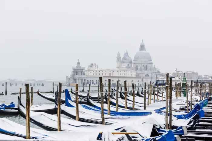 Framed Print : Winter snowfall in the city of Venice, gondolas covered by snow Framed Print : Winter snowfall in the city of Venice, gondolas covered by snow