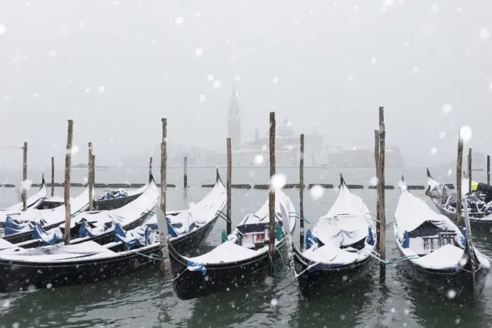 Framed Print : Winter snowfall in the city of Venice, gondolas covered by snow