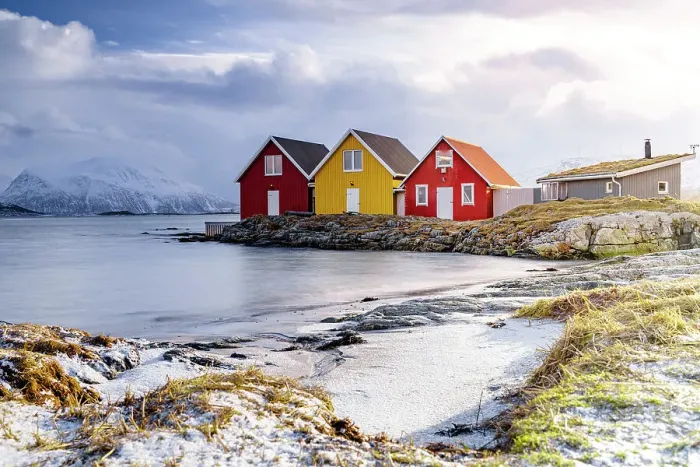 Framed Print : Winter sun over fishing huts along a frozen fjord, Sommaroy, Troms county, Norway