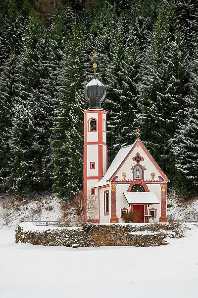 Winter view of Church of St. Johann in Ranui, Dolomites, Villnoss-Funes, South Tyrol, Italy