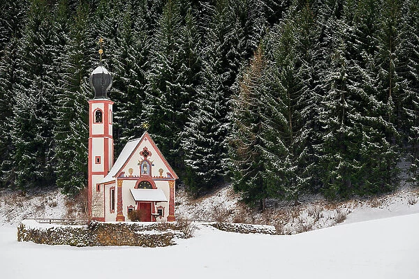 Winter view of Church of St. Johann in Ranui, Dolomites, Villnoss-Funes, South Tyrol, Italy