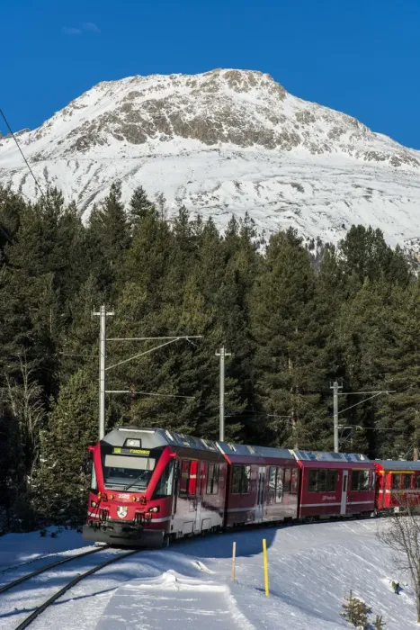 Framed Print : Winter view of the famous Bernina Express red train near Pontresina, Graubunden Framed Print : Winter view of the famous Bernina Express red train near Pontresina, Graubunden