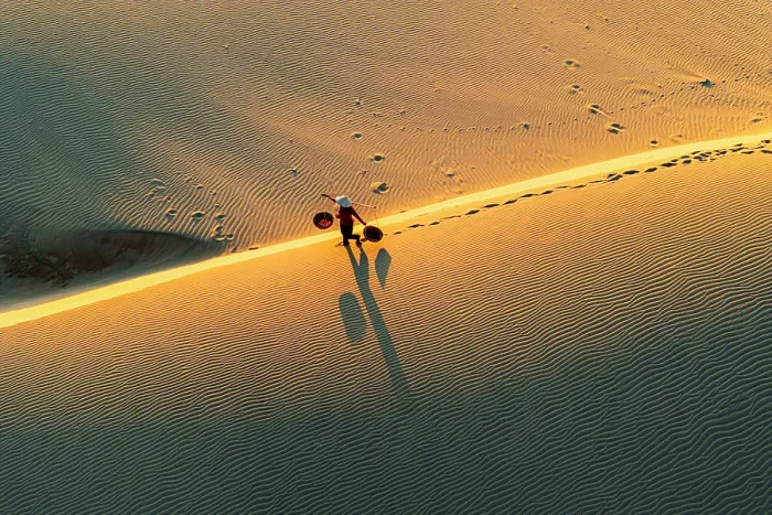 Framed Print : Woman with basket on golden dunes at dawn, Nam Cuong, Ninh Thuan Province, Vietnam. (MR) Framed Print : Woman with basket on golden dunes at dawn, Nam Cuong, Ninh Thuan Province, Vietnam. (MR)