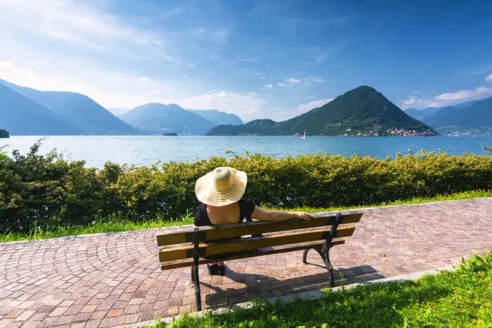 Framed Print : Woman on the bench in Iseo lake, Lombardy district, Brescia province, Italy. (MR) Framed Print : Woman on the bench in Iseo lake, Lombardy district, Brescia province, Italy. (MR)