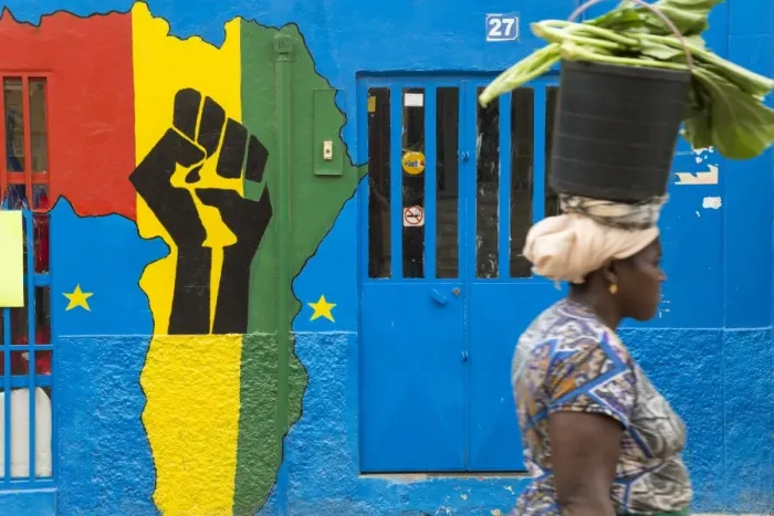 Framed Print : Woman with a bucket of vegetables in front of Africa shop front, Praia, Santiago, Cape Verde Framed Print : Woman with a bucket of vegetables in front of Africa shop front, Praia, Santiago, Cape Verde