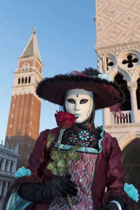 Framed Print : Woman in costume holding red rose during Carnival, Piazza San Marco (St Framed Print : Woman in costume holding red rose during Carnival, Piazza San Marco (St