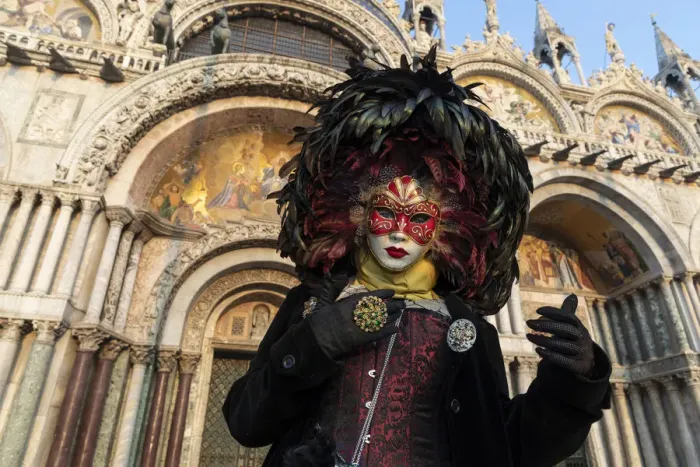Framed Print : A woman in costume stands in front of the Basilica San Marco in St Framed Print : A woman in costume stands in front of the Basilica San Marco in St
