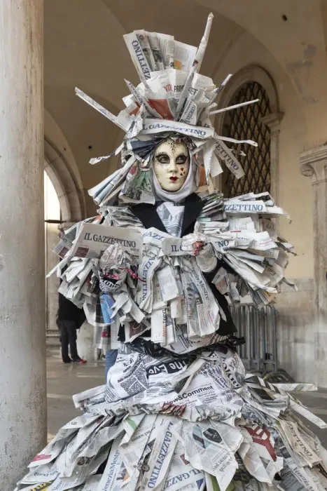 Framed Print : A woman covered in newspaper walks through St. Mark Framed Print : A woman covered in newspaper walks through St. Mark