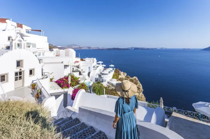Framed Print : woman dressed in blue in Oia, Santorini, Greek Islands, Greece Framed Print : woman dressed in blue in Oia, Santorini, Greek Islands, Greece