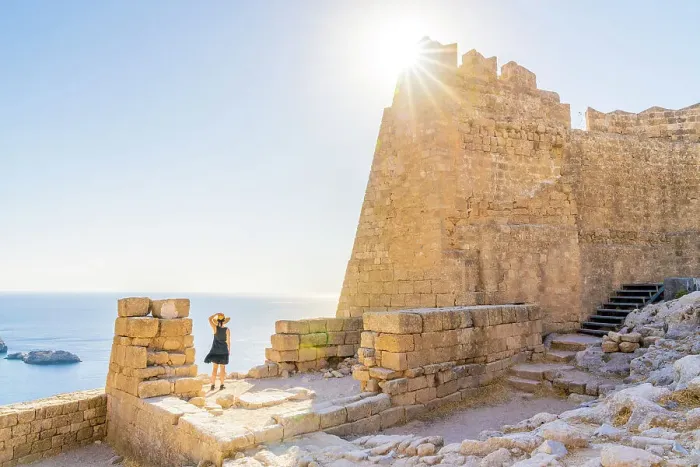 Framed Print : A woman in a hat at the Lindos Acropolis, Lindos, Rhodes, Dodecanese Islands, Greece. (MR)