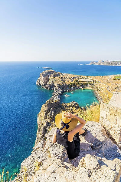 A woman in a hat at the Lindos Acropolis, Lindos, Rhodes, Dodecanese Islands, Greece. (MR)