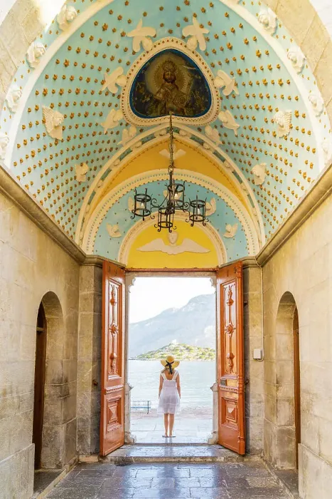 Framed Print : A woman in a hat at Panormitis Monastery, Symi, Dodecanese Islands, Greece. (MR)Symi, Dodecanese Islands, Greece. (MR) Framed Print : A woman in a hat at Panormitis Monastery, Symi, Dodecanese Islands, Greece. (MR)Symi, Dodecanese Islands, Greece. (MR)