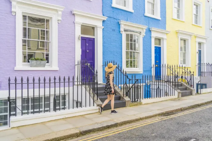Framed Print : A woman in a hat walking in a pretty street in Notting Hill, London, England, Uk, (MR) Framed Print : A woman in a hat walking in a pretty street in Notting Hill, London, England, Uk, (MR)