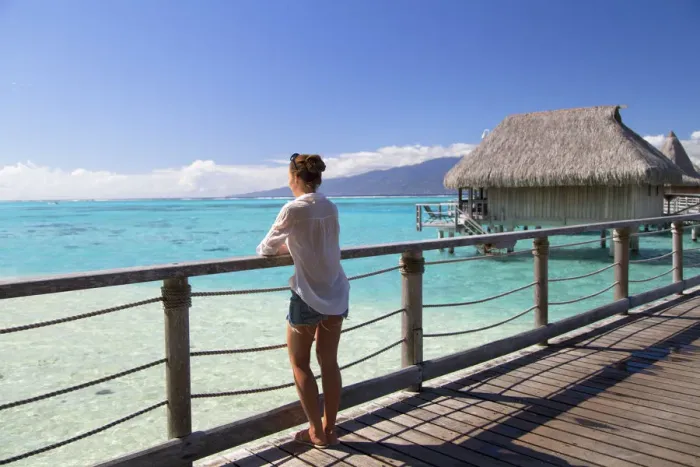 Framed Print : Woman on jetty of overwater bungalows of Sofitel Hotel, Moorea, Society Islands, French Framed Print : Woman on jetty of overwater bungalows of Sofitel Hotel, Moorea, Society Islands, French