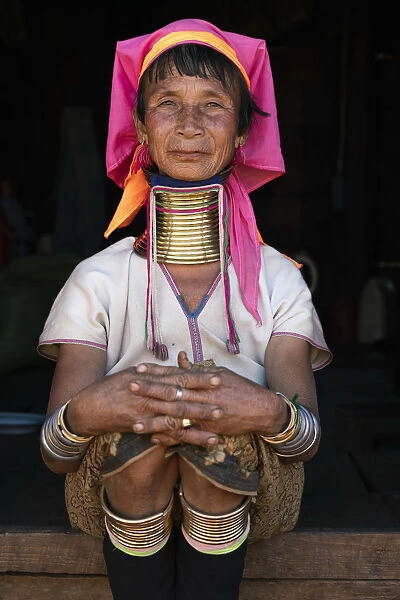 Woman from Kayan tribe wearing traditional brass neck rings, near Loikaw District