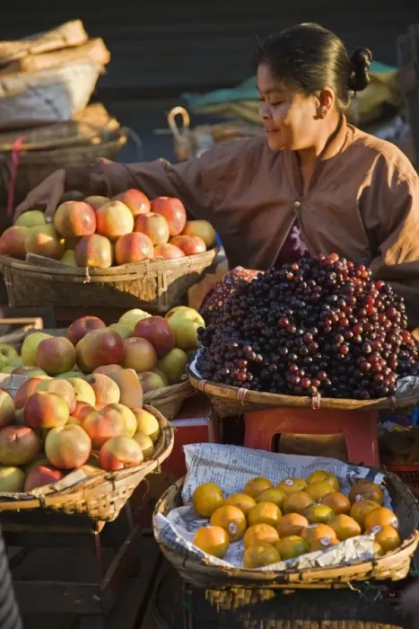 Framed Print : A woman sells a delicious selection of fresh fruit at Sittwes bustling market Framed Print : A woman sells a delicious selection of fresh fruit at Sittwes bustling market
