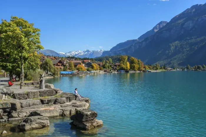 Framed Print : Woman sitting on the bank of Lake Brienz, Brienz, Berner Oberland, Switzerland Framed Print : Woman sitting on the bank of Lake Brienz, Brienz, Berner Oberland, Switzerland