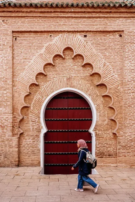 Framed Print : Woman student and typical arab door, Marrakech, Morocco Framed Print : Woman student and typical arab door, Marrakech, Morocco