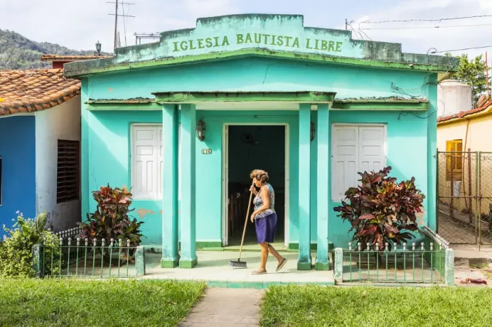 Framed Print : A woman sweeping the porch of her house in Vinales, Pinar del Rio Province, Cuba Framed Print : A woman sweeping the porch of her house in Vinales, Pinar del Rio Province, Cuba