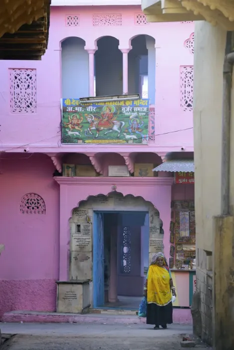 Framed Print : Woman walkin in front of colourful house, Pushkar, India, Asia Framed Print : Woman walkin in front of colourful house, Pushkar, India, Asia