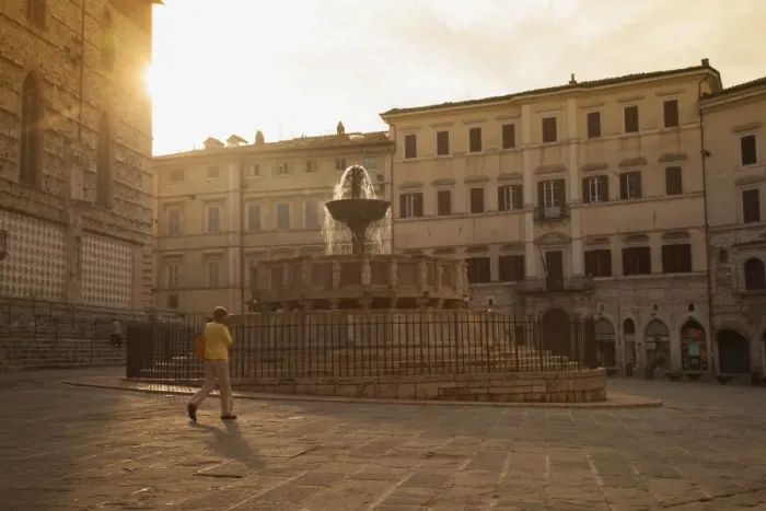 Framed Print : Woman walking past Fontana Maggiore in Piazza IV Novembre at dawn Perugia, Umbria, Italy Framed Print : Woman walking past Fontana Maggiore in Piazza IV Novembre at dawn Perugia, Umbria, Italy