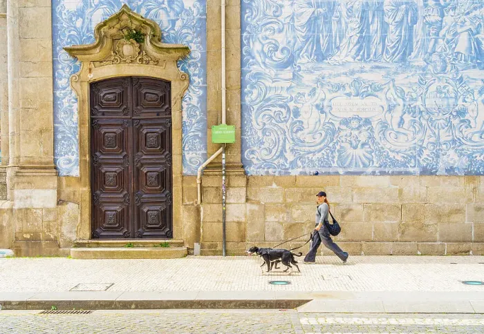 Framed Print : A woman walking past the tiled wall of Carmo Church, Porto, Portugal, Europe Framed Print : A woman walking past the tiled wall of Carmo Church, Porto, Portugal, Europe