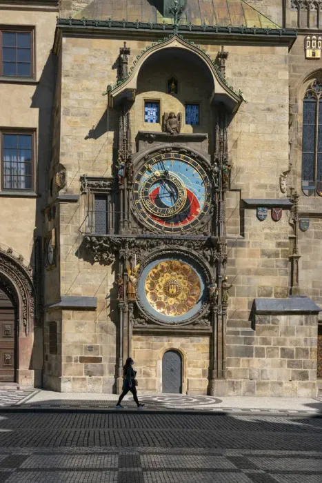Framed Print : Woman walking by Prague Astronomical Clock at Old Town Square, Prague, Bohemia Framed Print : Woman walking by Prague Astronomical Clock at Old Town Square, Prague, Bohemia