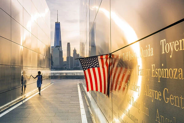 Woman walking through the Empty skies 9  /  11 memorial in Liberty state park, New York, USA