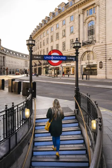 Framed Print : Woman walking out the tube on to Regents Street, london, England, UK Framed Print : Woman walking out the tube on to Regents Street, london, England, UK