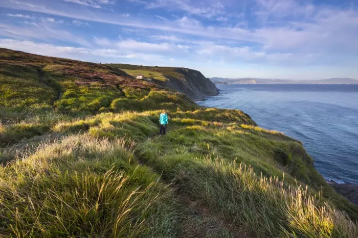 Framed Print : A woman walks over the cliff of the beach Barrika Hondartza, Biscaglia, Basque Country, Spain (MR) Framed Print : A woman walks over the cliff of the beach Barrika Hondartza, Biscaglia, Basque Country, Spain (MR)