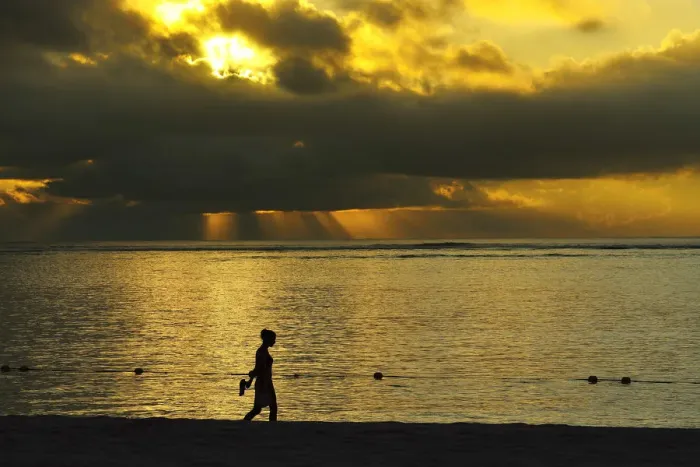 Framed Print : Woman walks along Le Morne beach, Mauritius, Indian Ocean, MR Framed Print : Woman walks along Le Morne beach, Mauritius, Indian Ocean, MR