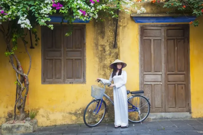 Framed Print : Woman wearing Ao Dai dress with bicycle, Hoi An (UNESCO World Heritage Site), Quang Ham Framed Print : Woman wearing Ao Dai dress with bicycle, Hoi An (UNESCO World Heritage Site), Quang Ham
