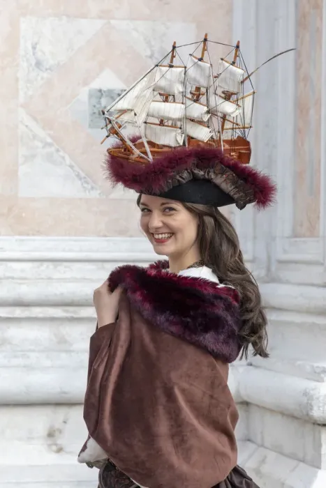 Framed Print : A woman wearing a hat decorated with an old sailing ship poses at the Venice Carnival Framed Print : A woman wearing a hat decorated with an old sailing ship poses at the Venice Carnival