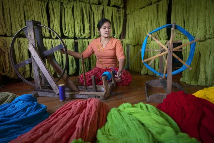 Framed Print : Woman winding up thread at weaving workshop on Lake Inle, Nyaungshwe Township Framed Print : Woman winding up thread at weaving workshop on Lake Inle, Nyaungshwe Township