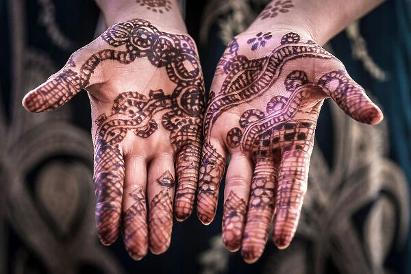 Woman's hands decorated with henna, Taouz, Morocco