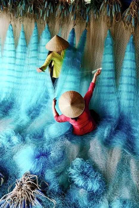 Framed Print : Women mending fishing nets, Vietnam. (MR) Framed Print : Women mending fishing nets, Vietnam. (MR)