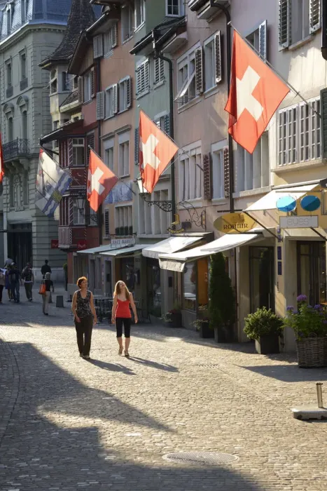 Framed Print : Two women walking in Augustinergasse, Zurich, Switzerland, Europe