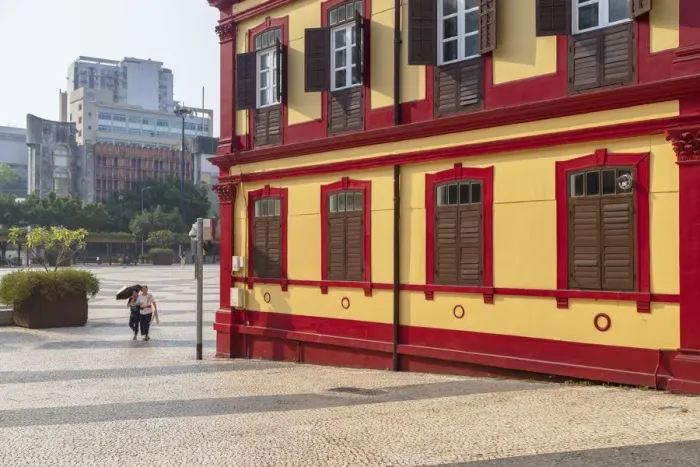 Framed Print : Women walking past Central Library on Tap Seac Square Macau, China Framed Print : Women walking past Central Library on Tap Seac Square Macau, China
