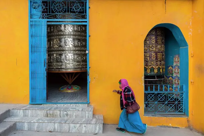 Framed Print : Women walking past prayer wheels at Swayambhunath, Kathmandu, Nepal Framed Print : Women walking past prayer wheels at Swayambhunath, Kathmandu, Nepal