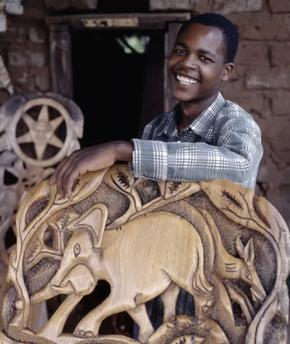 Framed Print : A wood carver puts the finishing touches to a Chiefs chair Framed Print : A wood carver puts the finishing touches to a Chiefs chair