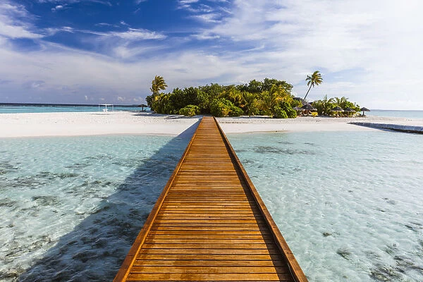 Wooden jetty to a tropical island, Maldives