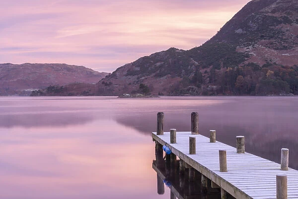 Wooden jetty on Ullswater at dawn on a frosty winter morning, Lake District, Cumbria